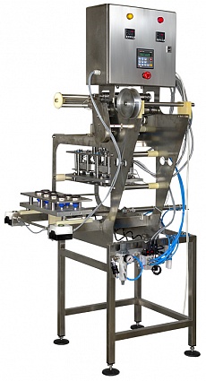 Полуавтоматическая упаковочная машина модель TРС с формированием крышки из рулона